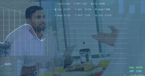 Asian businessman holding tablet reviewing financial charts and analytics at breakfast meeting