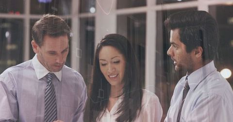 Diverse Team Business Meeting with Statistical Analysis Graphics