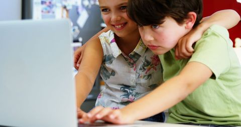 Engaged Young Children Exploring Educational Content on Laptop - Download Free Stock Images Pikwizard.com