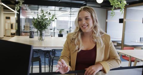 Confident Businesswoman Having Video Conference in Modern Office