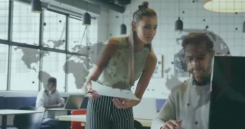 Colleagues Analyzing Data Trends in Modern Office