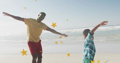 Father and son playing and balancing on sunny beach with gold star overlay, joyful family moment