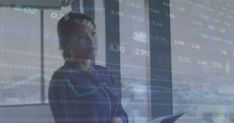 Businesswoman analyzing financial data block high rise office