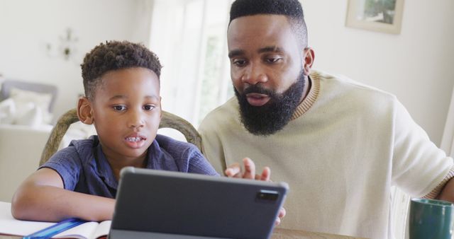 Father Teaching Son Using Tablet at Home - Download Free Stock Images Pikwizard.com