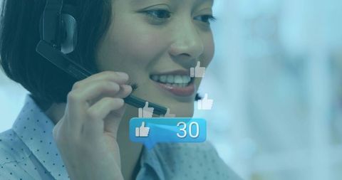 Smiling customer service agent wearing headset handling calls with social likes 30 overlay