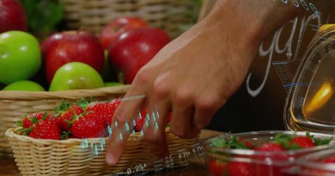 Data Processing Overlay as Man Selects Fresh Produce