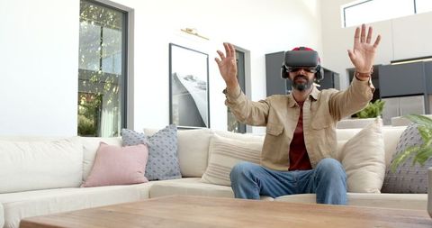 Man using vr headset for immersive virtual experience at home