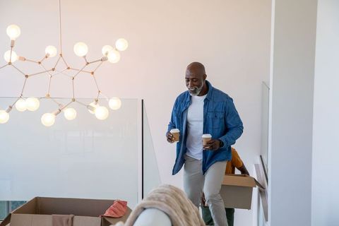 Diverse Friends Moving to New Home, Enjoying Coffee Break