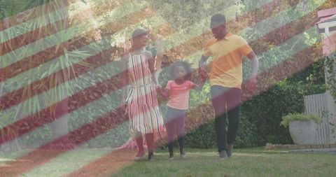 Happy Family Walking Through Lush Garden on Sunny Day