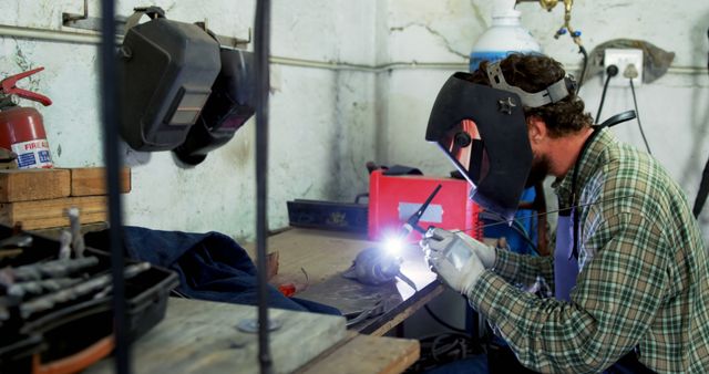 Industrial Welder in Protective Gear Working with Precision - Download Free Stock Images Pikwizard.com