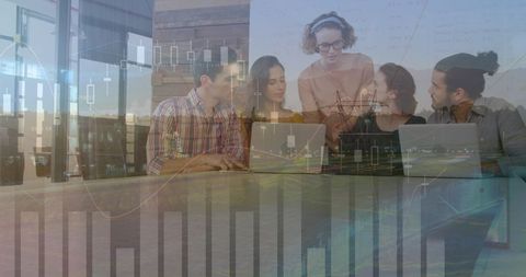 Diverse Business Team Analyzing Financial Data Projection with Laptops