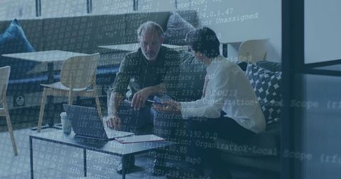 Business Professionals Collaborating on Coding Project in Modern Office