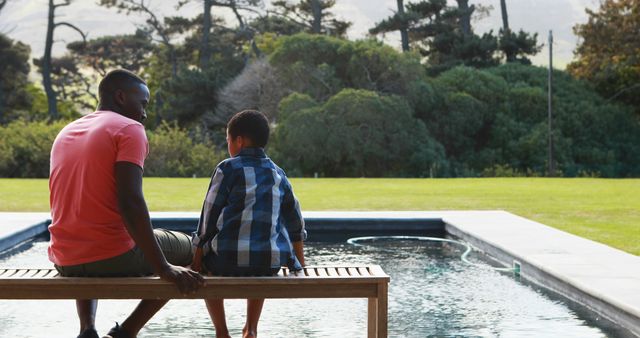 Father and Son Relaxing by Poolside Bonding with Nature - Download Free Stock Images Pikwizard.com