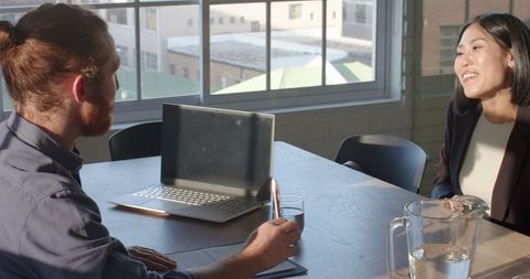 Collaborative Business Meeting in Sunlit Office
