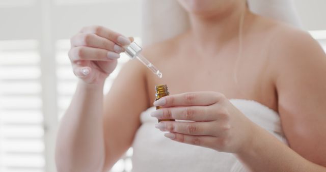 Woman Applying Serum with Dropper After Bath - Download Free Stock Images Pikwizard.com