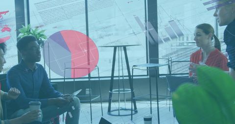 Diverse Business Team Engaging with Data Visualization in Office