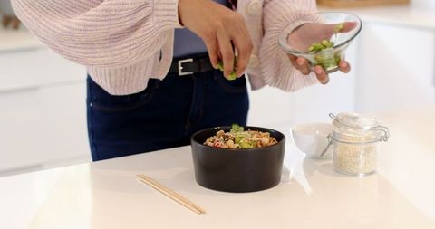 Preparing Healthy Edamame Bowl in Modern Kitchen