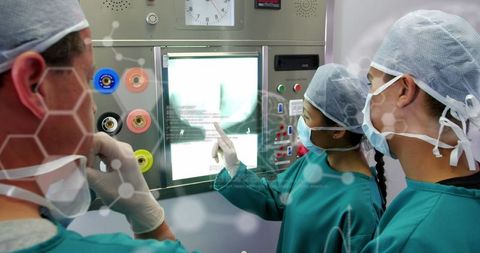Team of Surgeons Analyzing X-Ray in Medical Facility - Download Free Stock Images Pikwizard.com