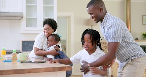 Father Helping Son with School Preparation During Morning Routine
