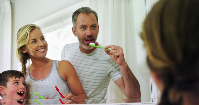 Caucasian Family Practicing Dental Hygiene Together with Happy Smiles - Download Free Stock Images Pikwizard.com