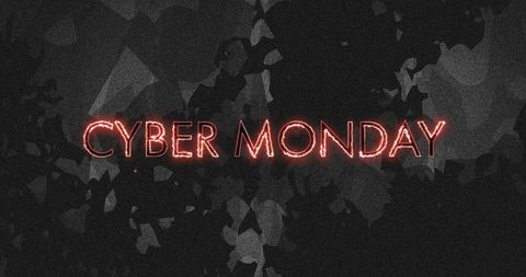 Fiery cyber monday text over distressed black background