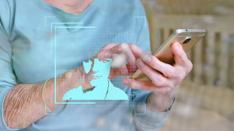 Senior Woman Engaging with Smartphone and Digital Interface