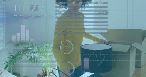 Couple Analyzing Data and Unpacking Boxes at New Home