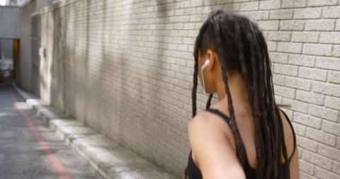African American Woman Jogging Listening to Music City Street - Download Free Stock Images Pikwizard.com