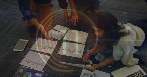 Colleagues Analyzing Data Spreadsheets in Office Meeting