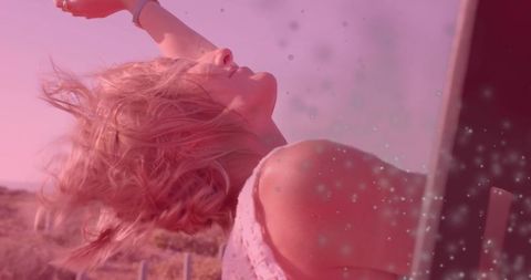 Woman Relaxing Outdoors With Sunlit Sparkles and Serenity