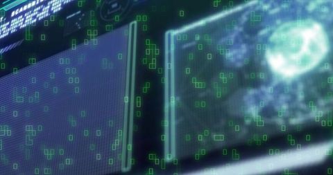 Futuristic HUD displaying dual monitoring panels with holographic green data overlays