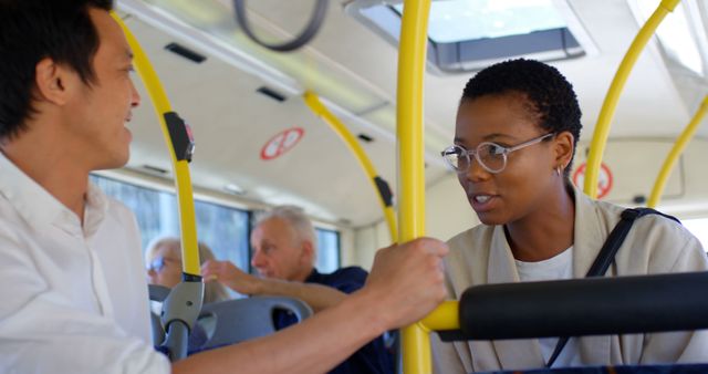 Diverse Commuters Engaging in Conversation on City Bus - Download Free Stock Images Pikwizard.com