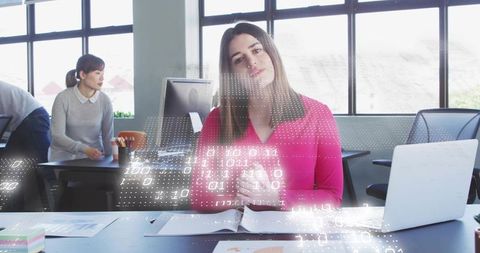 Woman presenting with digital data overlay guiding team in bright collaborative office