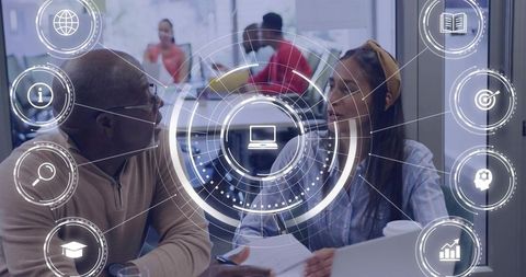 Business Professionals Collaborating Over Documents With Futuristic Digital HUD and Laptop