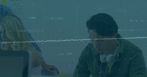 Business People Analyzing Financial Data in Modern Office Setting