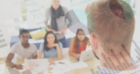 Analyzing Financial Data with Diverse Business Team in Modern Office