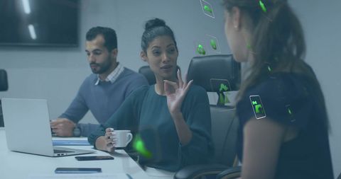 Diverse Team in Office Discussing Sustainability Concepts