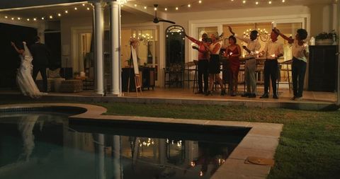 Elegant evening wedding reception with bride and groom