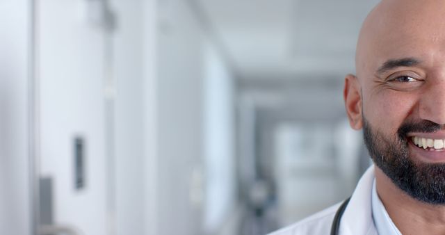 Smiling Doctor in Hospital Hallway Close-Up with Bright Background - Download Free Stock Images Pikwizard.com