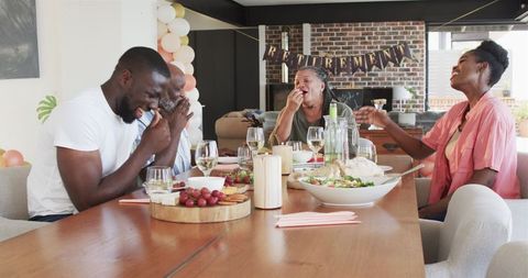 Family Celebrating Retirement Party with Laughter and Joy