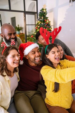 Diverse Friends Taking Christmas Selfie Celebrating Joyfully