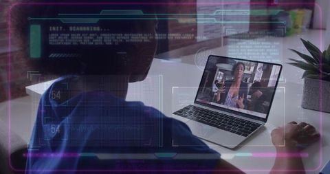 Remote worker watching video call on laptop with futuristic HUD overlay and headset
