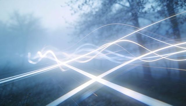 Ethereal intersecting light trails forming glowing x over misty forest twilight with flowing streaks