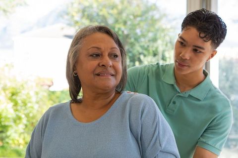 Mother and Son Sharing Warm Moment by Sunlit Window