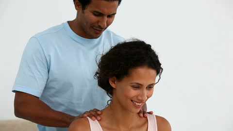 Smiling Couple Enjoying Relaxing At-Home Massage Session