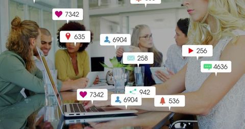 Blonde woman typing on laptop during team meeting with social media notification overlays