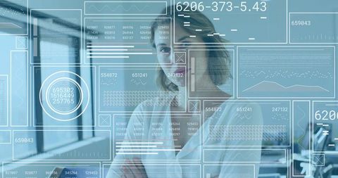 Female executive analyzing futuristic hud analytics overlay in modern glass office