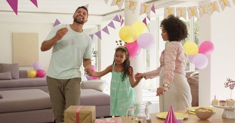 Family Celebrating Birthday With Smiles and Joyful Decorations