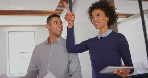 Colleagues Gesturing During Productive Discussion in Office