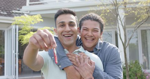 Happy Gay Couple Celebrating New Home Ownership Outdoors - Download Free Stock Images Pikwizard.com